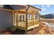 New wooden back porch with railing and steps at 9315 Turkey Way, Middlesex, NC 27557