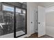 Bathroom featuring a glass shower enclosure with a black tiled backdrop, paired with a white door at 9315 Turkey Way, Middlesex, NC 27557
