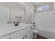Bright bathroom featuring a white vanity, toilet, and shower-tub combination at 9315 Turkey Way, Middlesex, NC 27557