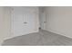 Neutral bedroom with carpet, double closets, and a white door at 9315 Turkey Way, Middlesex, NC 27557