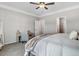 Comfortable bedroom with neutral walls, ceiling fan, carpet, and writing desk at 9315 Turkey Way, Middlesex, NC 27557