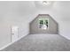 Bonus room featuring carpet, a dormer window, and neutral walls at 9315 Turkey Way, Middlesex, NC 27557