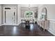 Elegant dining room with a round table, stylish chairs, and a modern chandelier, plus a sideboard with decor at 9315 Turkey Way, Middlesex, NC 27557