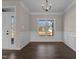Open dining room featuring elegant chandelier and trim at 9315 Turkey Way, Middlesex, NC 27557