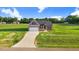 Beautiful single-Gathering home with an attached garage on a lush green lawn and a curving concrete driveway at 9315 Turkey Way, Middlesex, NC 27557
