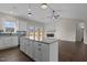 Bright kitchen featuring a central island, stainless steel appliances, and an adjacent living area with a fireplace at 9315 Turkey Way, Middlesex, NC 27557