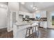 Stylish kitchen with white cabinets, granite countertops, a kitchen island with seating, and stainless steel appliances at 9315 Turkey Way, Middlesex, NC 27557