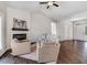 Inviting living room with a modern fireplace, neutral furniture, and ample natural light, showcasing a cozy and stylish space at 9315 Turkey Way, Middlesex, NC 27557
