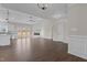 Spacious living room with an electric fireplace, ceiling fan and wood floors at 9315 Turkey Way, Middlesex, NC 27557