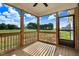 Covered porch featuring wood flooring, wood trim, and a beautiful, scenic backyard view at 9315 Turkey Way, Middlesex, NC 27557