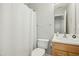 Bathroom featuring a toilet, sink, and shower with a white curtain at 938 Widewaters Pkwy, Knightdale, NC 27545