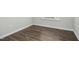 Bedroom with neutral walls, white base trim, and hard surface floors at 938 Widewaters Pkwy, Knightdale, NC 27545