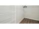 Walk-in closet with shelving and wood-look flooring at 938 Widewaters Pkwy, Knightdale, NC 27545