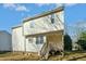 Charming home exterior featuring a cozy back porch and classic vinyl siding at 938 Widewaters Pkwy, Knightdale, NC 27545