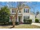 Inviting two-story home with brick accents and a well-manicured lawn at 938 Widewaters Pkwy, Knightdale, NC 27545