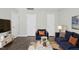 Living room with couch, chair, and hard surface flooring at 938 Widewaters Pkwy, Knightdale, NC 27545