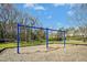 Community playground featuring swings and mature trees at 938 Widewaters Pkwy, Knightdale, NC 27545