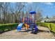 Community playground featuring a climbing structure and mature trees at 938 Widewaters Pkwy, Knightdale, NC 27545