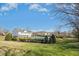 View of the community pool surrounded by lush landscaping and green space at 938 Widewaters Pkwy, Knightdale, NC 27545