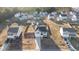 Aerial view of the home with surrounding neighborhood, sheds, and fenced yard at 95 Westbrook Ln, Franklinton, NC 27525