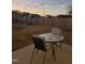 Cozy backyard patio featuring string lights, outdoor table and chairs for relaxing evenings at 95 Westbrook Ln, Franklinton, NC 27525