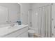 Bathroom with vanity sink and decorative items, alongside a bathtub and shower combination at 95 Westbrook Ln, Franklinton, NC 27525