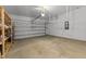 Spacious garage featuring overhead storage and a clean, concrete floor at 95 Westbrook Ln, Franklinton, NC 27525