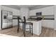 Bright kitchen featuring white cabinets, stainless steel appliances, granite countertops, and an island at 95 Westbrook Ln, Franklinton, NC 27525
