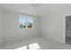 Bright and airy bedroom with a large window, neutral carpet, and plenty of natural light at 100 Sire Ct, Holly Springs, NC 27540