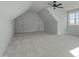 Large bonus room with sloped ceilings, neutral carpet, and a ceiling fan at 100 Sire Ct, Holly Springs, NC 27540