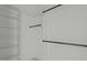 Custom closet design with shelving, closet rods, and storage space at 100 Sire Ct, Holly Springs, NC 27540