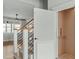 Hallway featuring stairs, a modern railing, and an elevator at 100 Sire Ct, Holly Springs, NC 27540