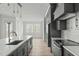 Modern kitchen with a large island, stainless steel appliances, and plenty of counter space at 100 Sire Ct, Holly Springs, NC 27540