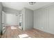 Open living area with wainscoting and hardwood floors at 100 Sire Ct, Holly Springs, NC 27540