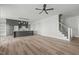Open-concept living space features a large island and hardwood floors at 100 Sire Ct, Holly Springs, NC 27540