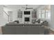 Well-lit living room with modern decor, fireplace, and built-in shelving at 100 Sire Ct, Holly Springs, NC 27540