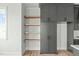Pantry with built in custom cabinets and open shelves at 100 Sire Ct, Holly Springs, NC 27540