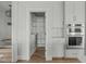 Walk-in pantry with built-in shelving and easy kitchen access at 100 Sire Ct, Holly Springs, NC 27540