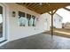 Covered patio featuring concrete floor, white siding, white trim, and outdoor lighting at 100 Sire Ct, Holly Springs, NC 27540