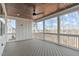 Covered porch with wood ceiling and walls of screened windows at 100 Sire Ct, Holly Springs, NC 27540