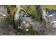 Aerial view of the house showcasing the backyard deck, lush landscaping, driveway, mature trees, and surrounding neighborhood at 1004 Colworth Way, Raleigh, NC 27614
