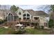 Aerial view of the backyard highlighting the decks, patio, and fire pit area at 1004 Colworth Way, Raleigh, NC 27614
