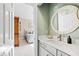 Bright bathroom with white counter and views into an adjacent bedroom at 1004 Colworth Way, Raleigh, NC 27614