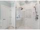 Elegant bathroom features a glass shower with mosaic tile accents and dual shower heads at 1004 Colworth Way, Raleigh, NC 27614