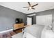 Bedroom features a dark ceiling fan, a dresser and neutral-toned furnishings at 1004 Colworth Way, Raleigh, NC 27614