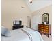 Bedroom with vaulted ceiling, two dressers, TV, and neutral color scheme for a calming retreat at 1004 Colworth Way, Raleigh, NC 27614