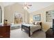 Cozy bedroom with vaulted ceiling, window seat, and a comfortable bed with neutral tones at 1004 Colworth Way, Raleigh, NC 27614