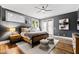 Comfortable bedroom with dark walls, ceiling fan, and light-colored rug at 1004 Colworth Way, Raleigh, NC 27614
