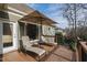 Comfortable deck features chaise lounges and an umbrella for relaxing outdoors at 1004 Colworth Way, Raleigh, NC 27614