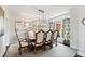 Formal dining room with classic decor, stylish lighting, and a window at 1004 Colworth Way, Raleigh, NC 27614